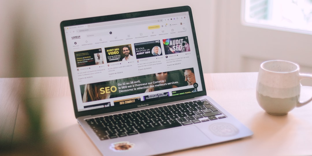 a-laptop-computer-sitting-on-top-of-a-wooden-table-tlul9g-ruz4